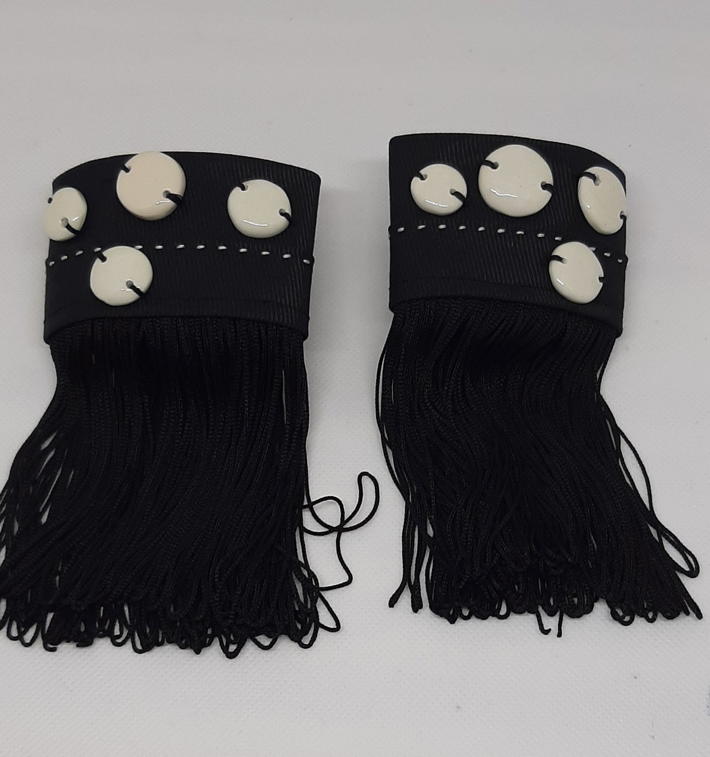 Epoque wrist cuffs in fabric and ceramic